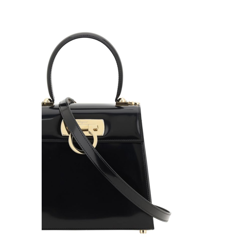 Discover the Ferragamo Black Calf Leather Bos Taurus Handbag, a masterpiece of exquisite craftsmanship and timeless elegance, perfect for the discerning individual.
