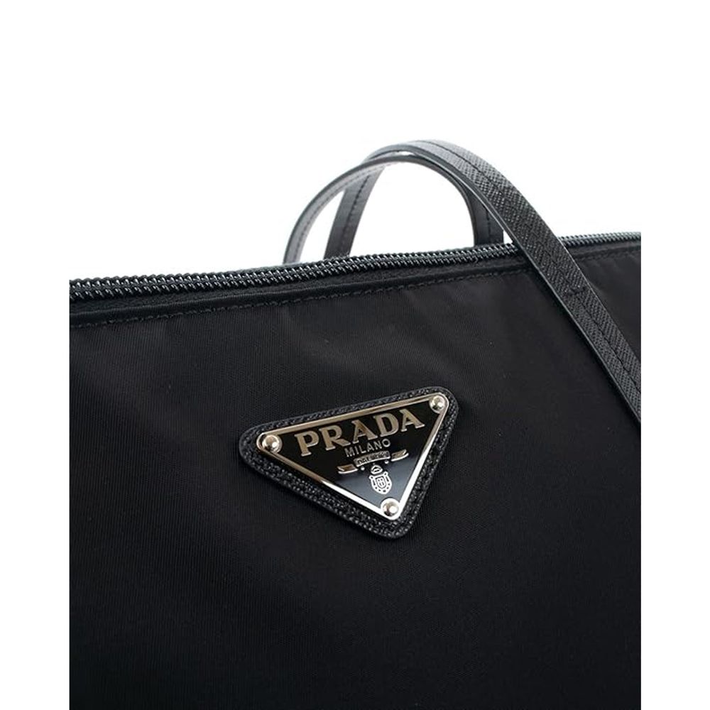 Discover the Prada Black Nylon Tote Bag, a masterpiece of exquisite craftsmanship and timeless elegance, perfect for those who embody luxury and sophistication.