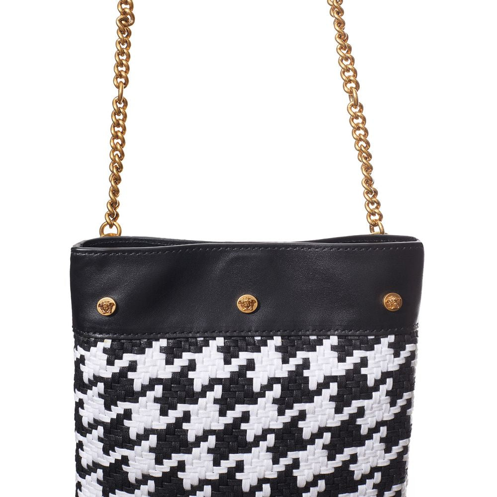 Discover the Versace Black And White Leather And Textile Shoulder Bag, a masterpiece of Italian craftsmanship that embodies luxury and elegance for the discerning connoisseur.