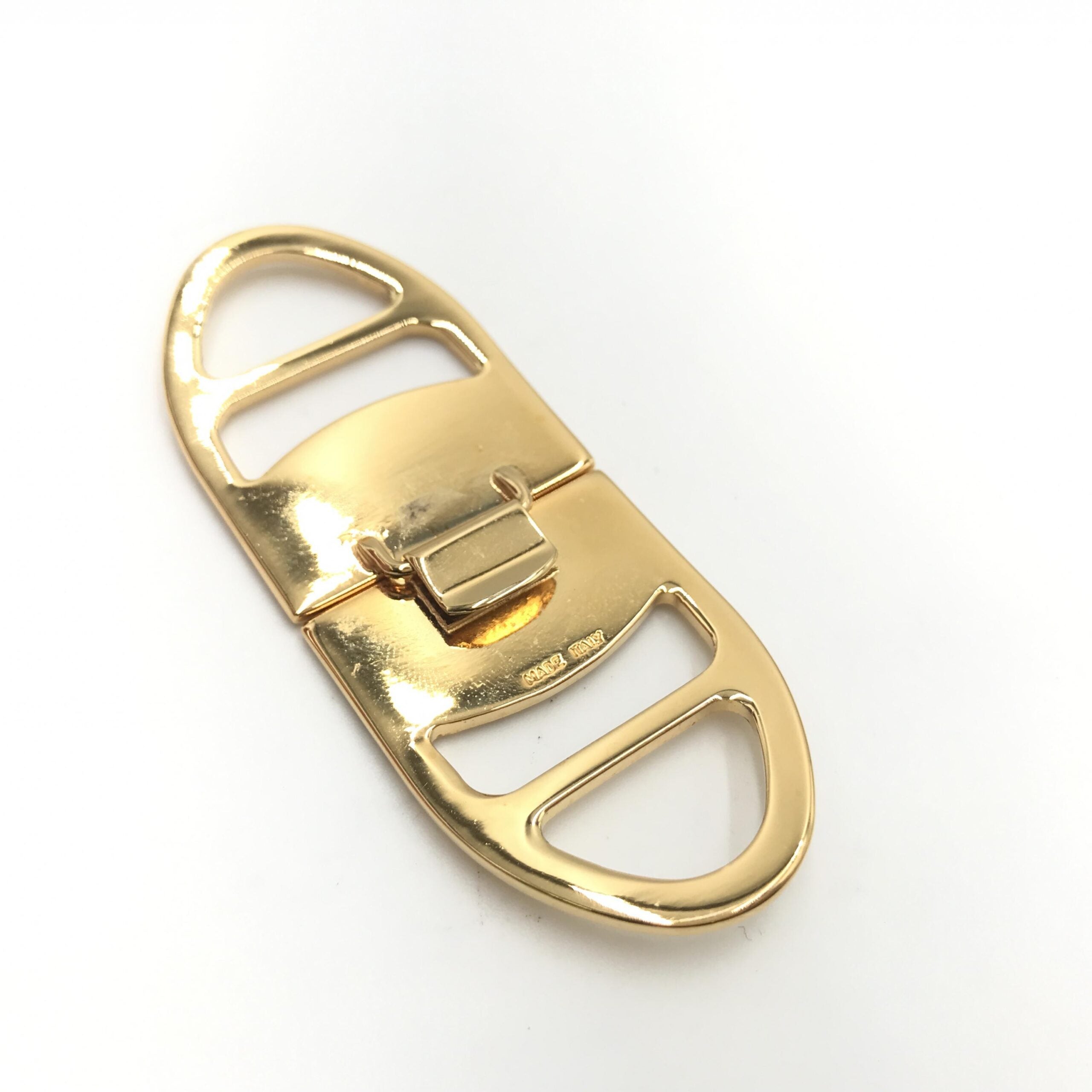 Elevate your style with the Salvatore Ferragamo Vara Metal Scarf Ring, a timeless piece of Italian craftsmanship that embodies luxury and sophistication.