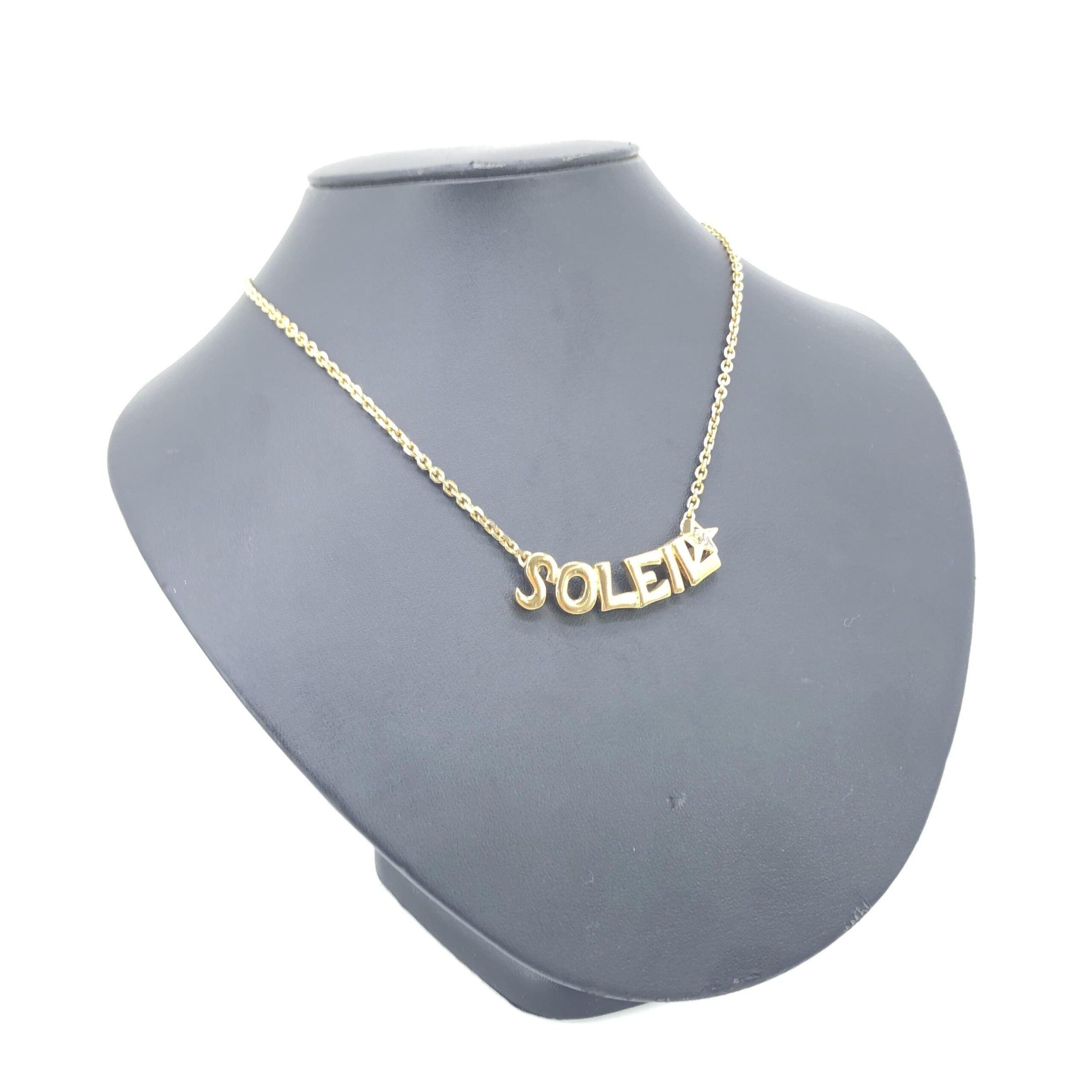 Elevate your elegance with the Yves Saint Laurent Soleil Designer Statement Necklace, a luxurious blend of gold-tone metal and rhinestones, crafted for timeless allure.