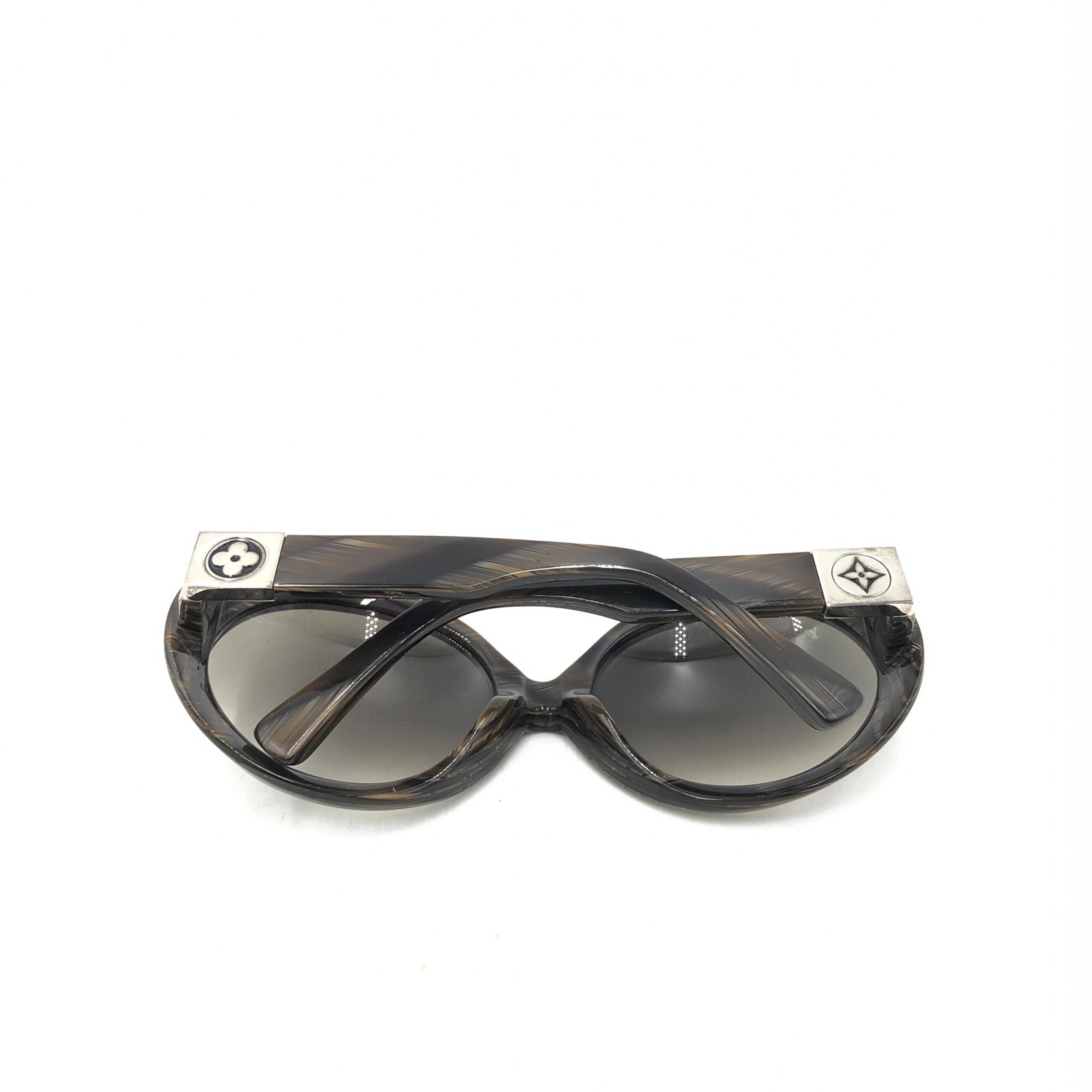 Elevate your style with Louis Vuitton's Suspense BugEye Sunglasses, featuring polarized lenses and exquisite craftsmanship, a timeless statement of luxury and sophistication.