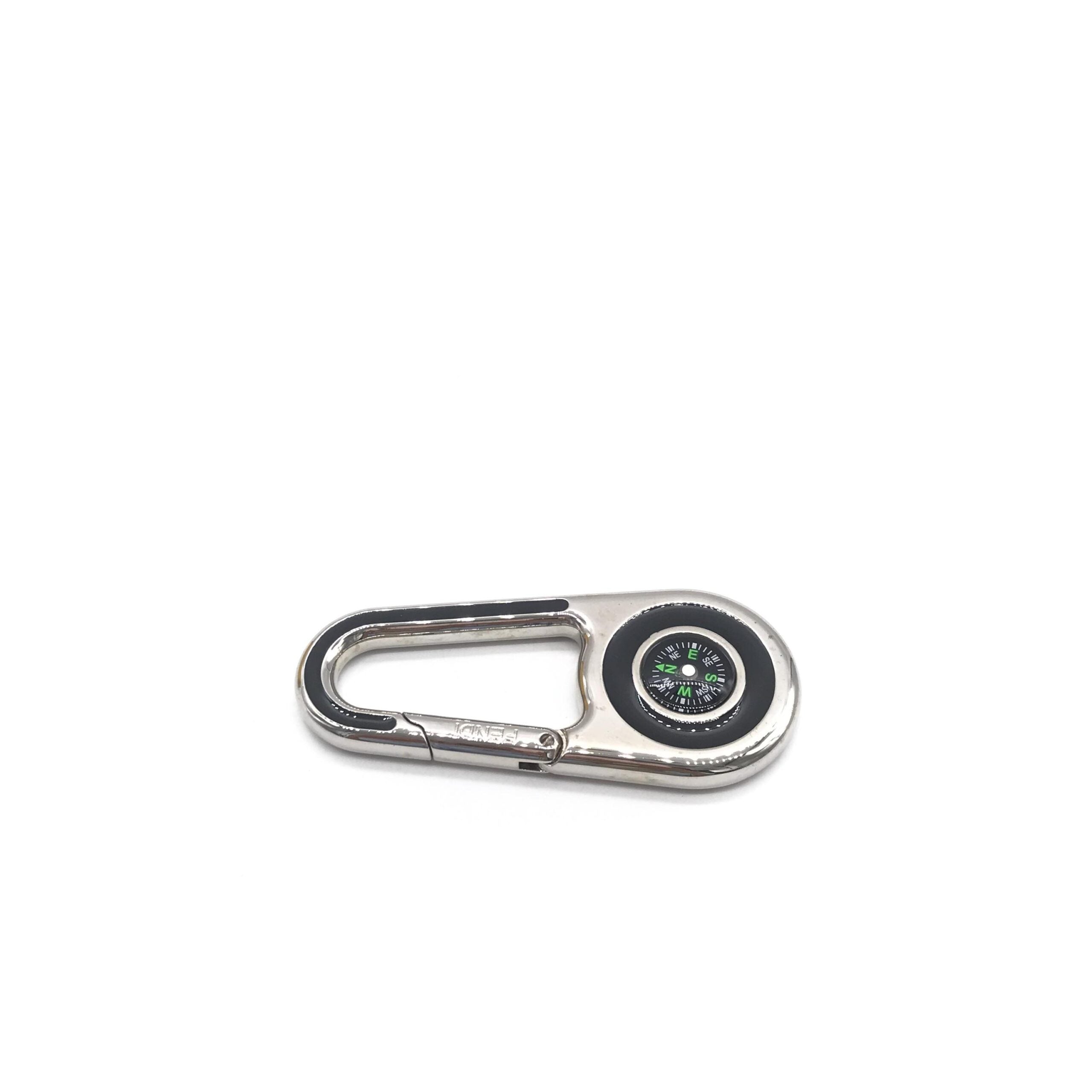 Elevate your style with the Fendi Silver Metal Compass Charm Keychain, a symbol of luxury and exquisite craftsmanship, perfect for life's sophisticated journeys.