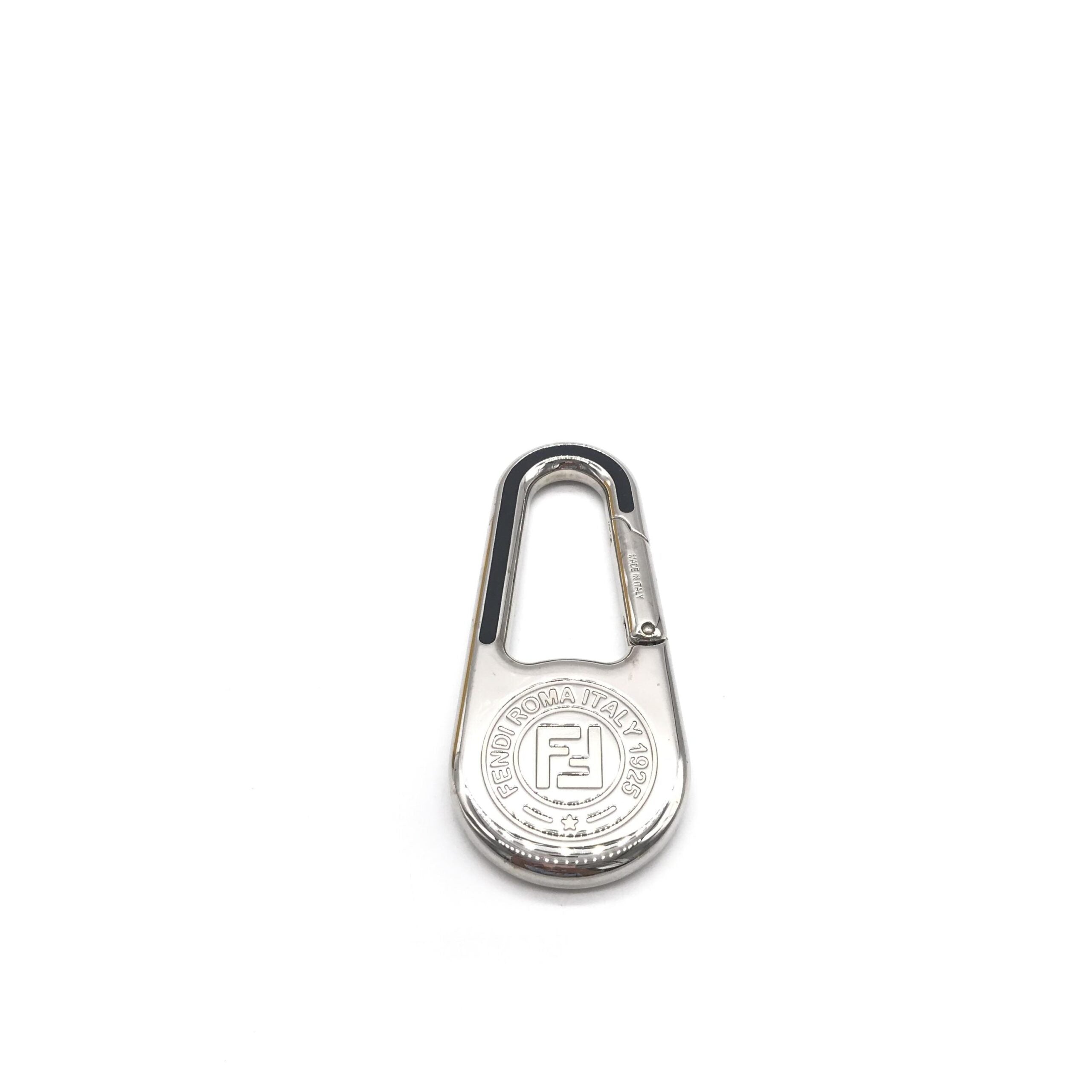 Elevate your style with the Fendi Silver Metal Compass Charm Keychain, a symbol of luxury and Italian craftsmanship, perfect for life's sophisticated journeys.