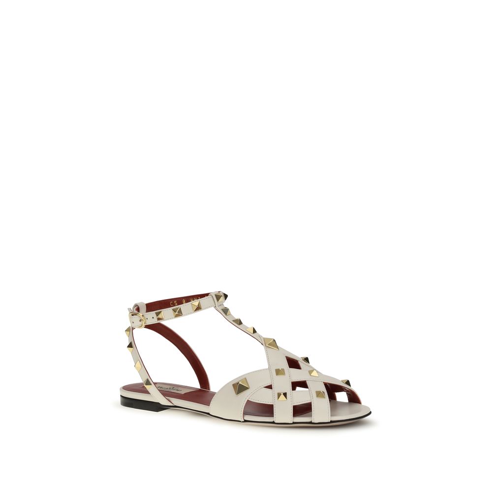 Indulge in the exquisite Valentino Garavani Beige Goatskin Flat Sandals, where Italian artistry meets luxurious comfort, perfect for elevating any ensemble with timeless sophistication.