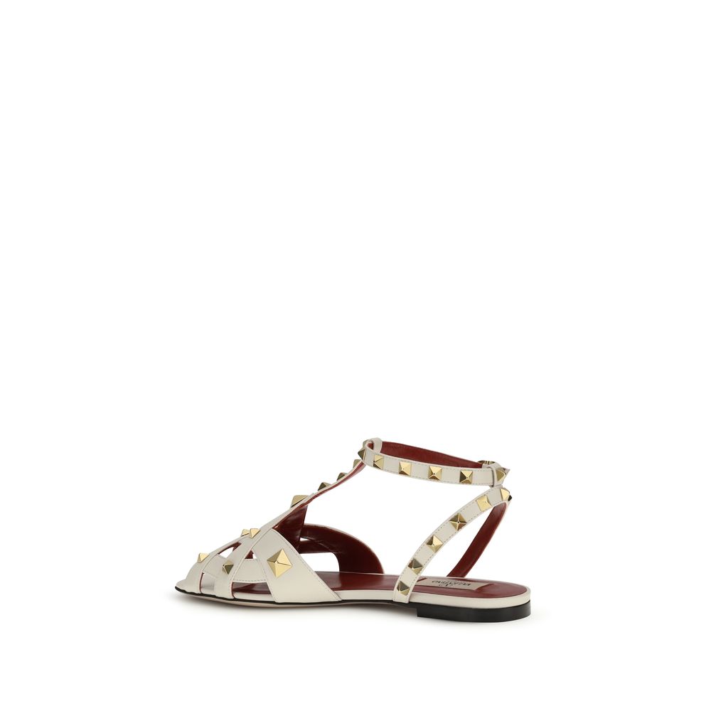 Step into the exquisite sophistication of Valentino Garavani's Beige Goatskin Flat Sandals, where Italian artistry meets timeless elegance for the discerning connoisseur.
