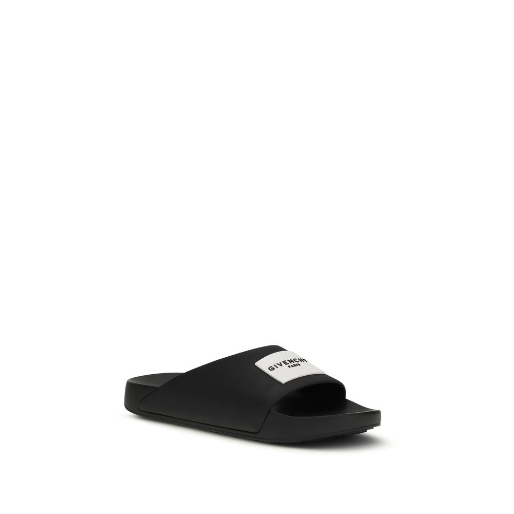 Step into the realm of luxury with Givenchy Black Rubber Sandals from the SS26 collection, where bold design meets exquisite comfort for the discerning individual.
