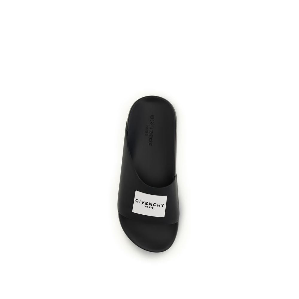 Step into the realm of luxury with Givenchy Black Rubber Sandals, crafted for the discerning individual. Experience bold design and unparalleled comfort in every step.