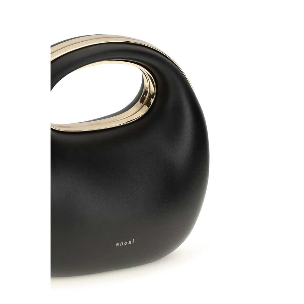 Indulge in the Sacai Black Calf Leather Bos Taurus Handbag, a masterpiece of meticulous craftsmanship and timeless elegance, perfect for elevating any sophisticated ensemble.