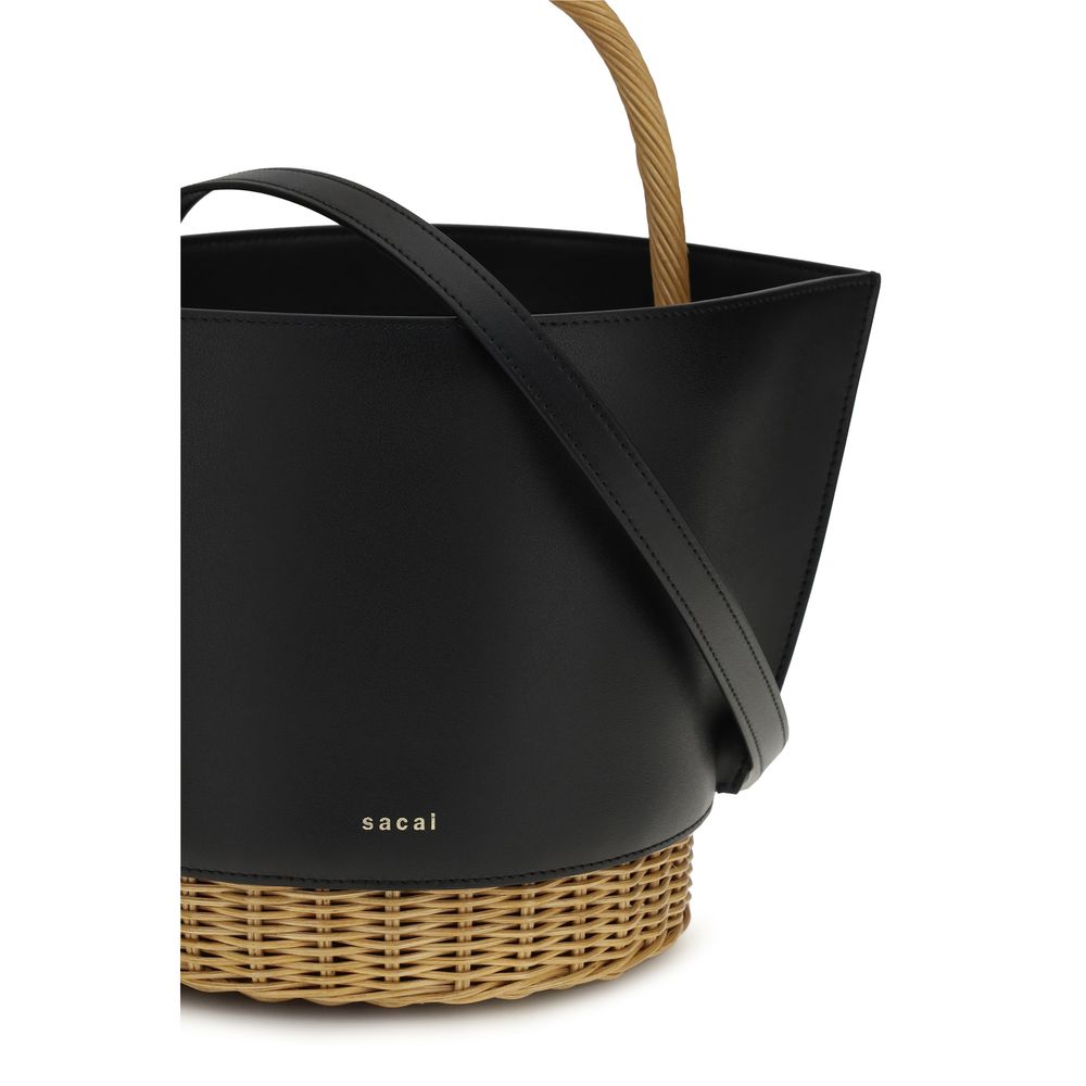 Discover the Sacai Black Calf Leather Bos Taurus Shoulder Bag, a masterpiece of exquisite craftsmanship and timeless elegance, perfect for elevating any ensemble.