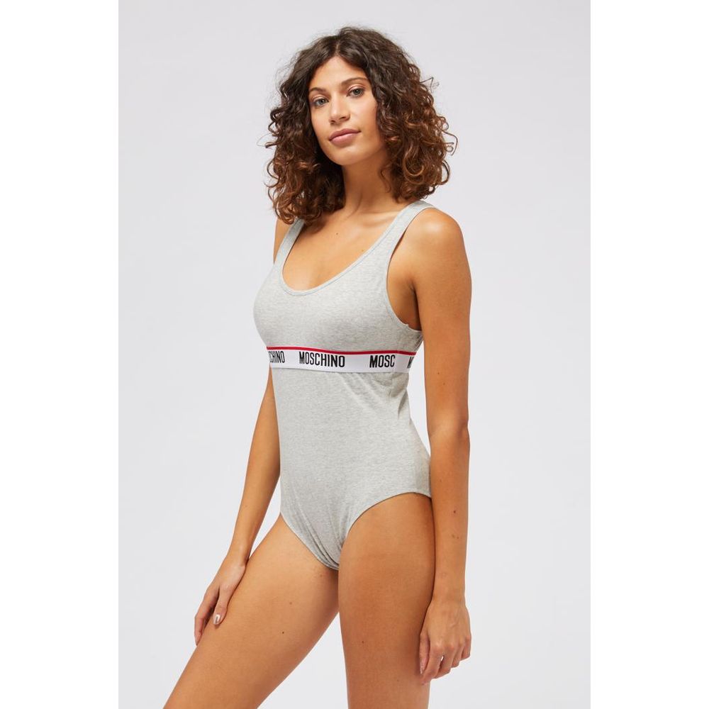 Indulge in the Moschino Gray Cotton Bodysuit, a 2023 masterpiece of luxury and comfort, crafted from a refined cotton blend for an effortlessly chic silhouette.
