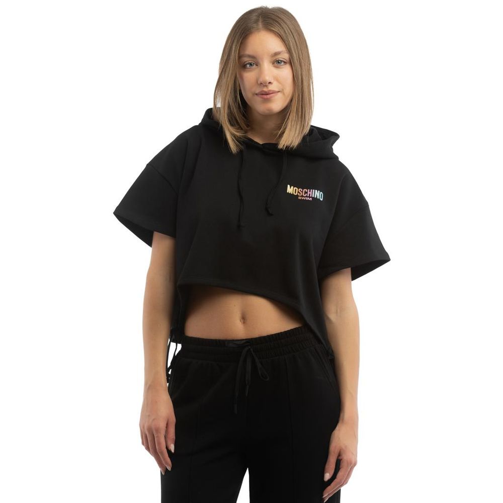 Indulge in the Moschino Black Cotton Sweatshirt, a masterpiece of contemporary luxury crafted from premium cotton, designed for those who embrace elegance and sophistication.
