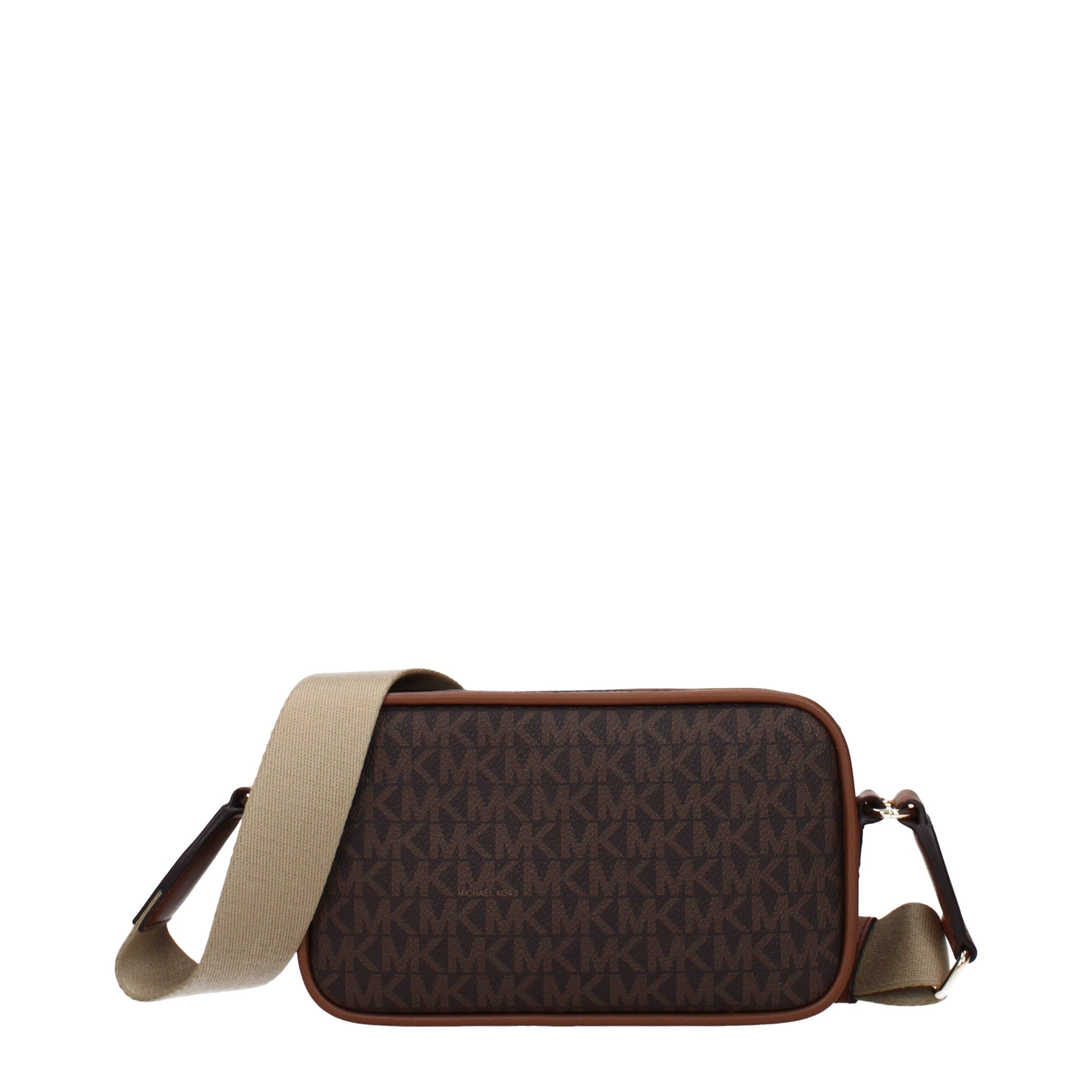 Elevate your style with the Michael Kors Brown Fabric Crossbody Bag, a masterpiece of luxury craftsmanship that embodies timeless elegance and versatile sophistication.