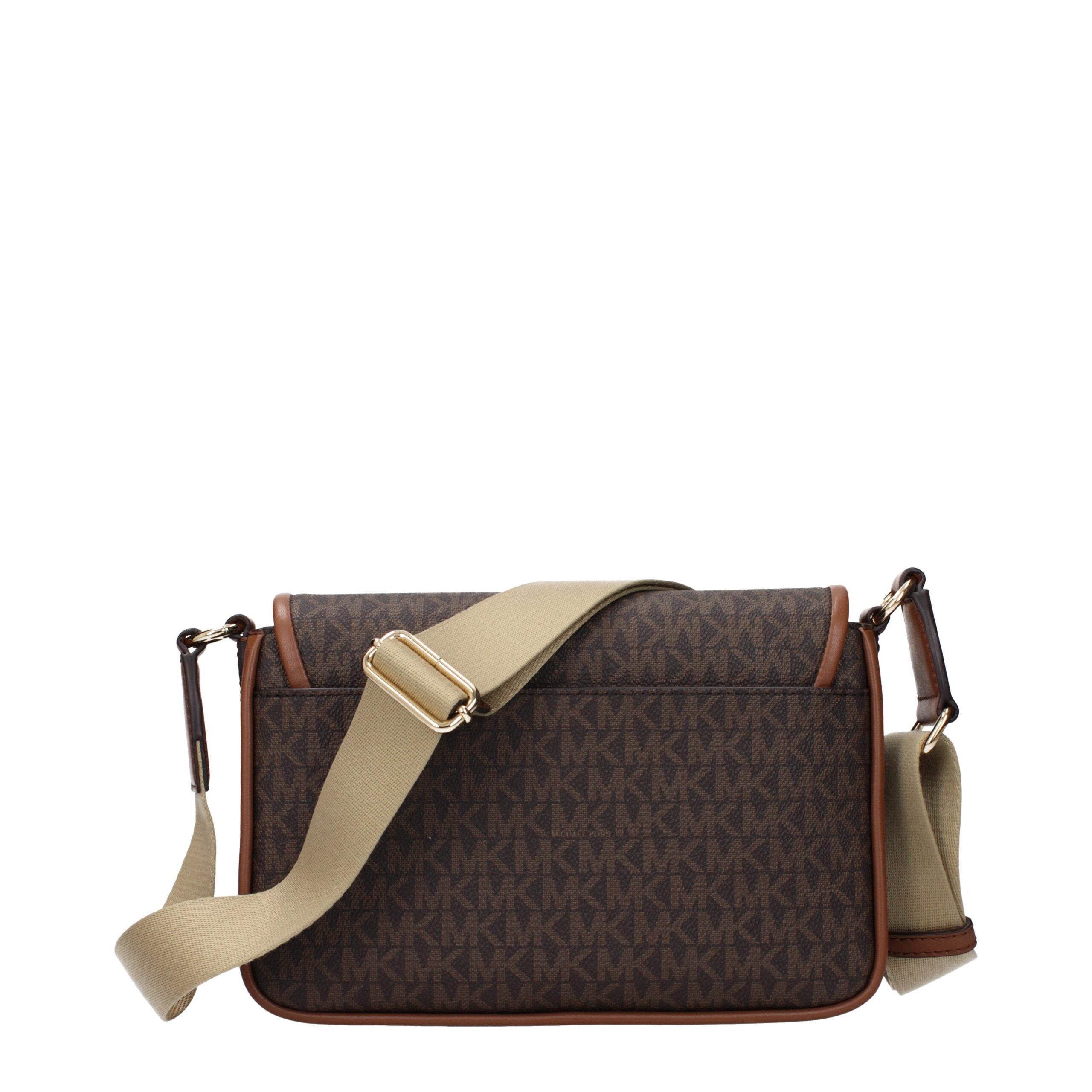 Elevate your style with the Michael Kors Brown Fabric Crossbody Bag, a masterpiece of artisanal luxury that embodies timeless elegance and impeccable craftsmanship.