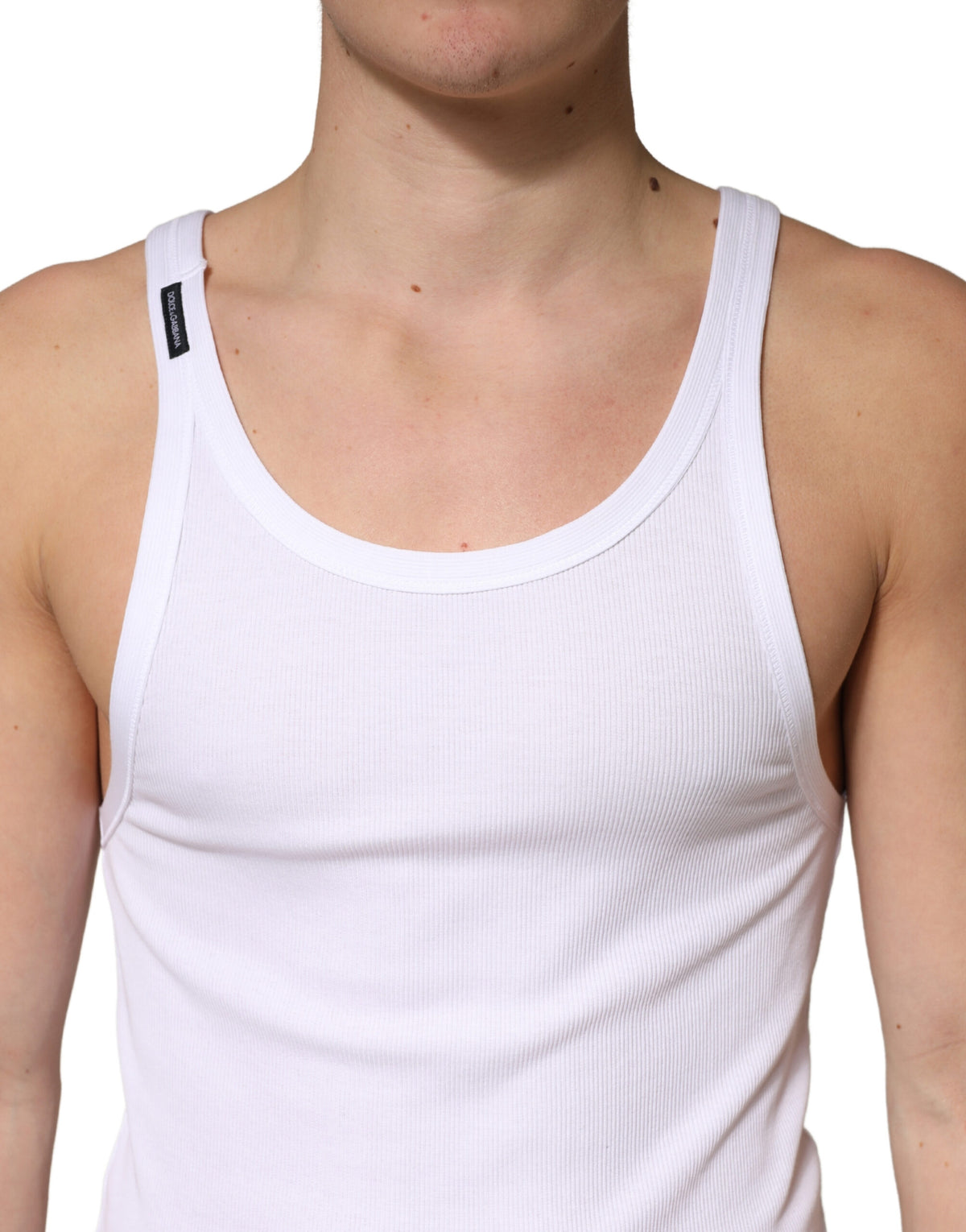 Discover the Dolce & Gabbana White Ribbed Cotton Sleeveless Tank Top, a masterpiece of Italian craftsmanship, blending luxurious comfort with timeless elegance for every occasion.