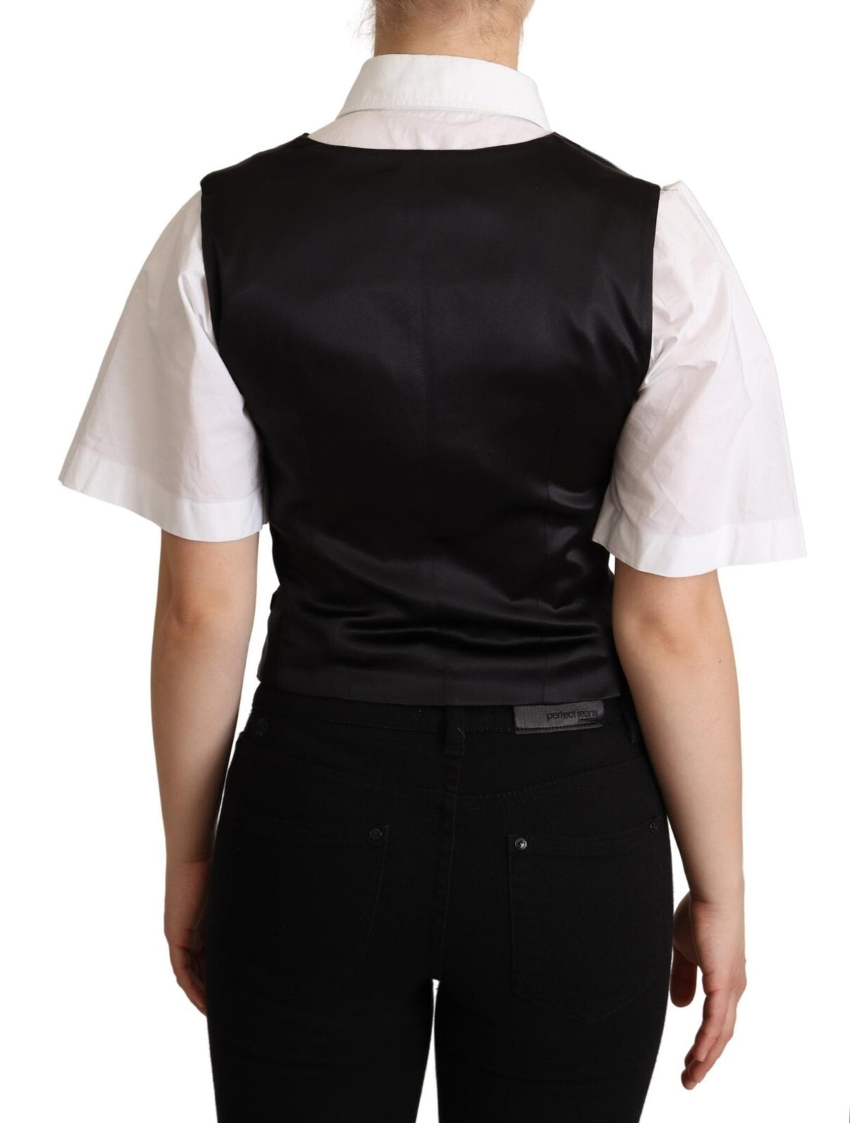 Elevate your wardrobe with the Dolce & Gabbana Solid Black Silk Sleeveless Waistcoat, a timeless piece crafted from luxurious silk twill, embodying Italian elegance and sophistication.