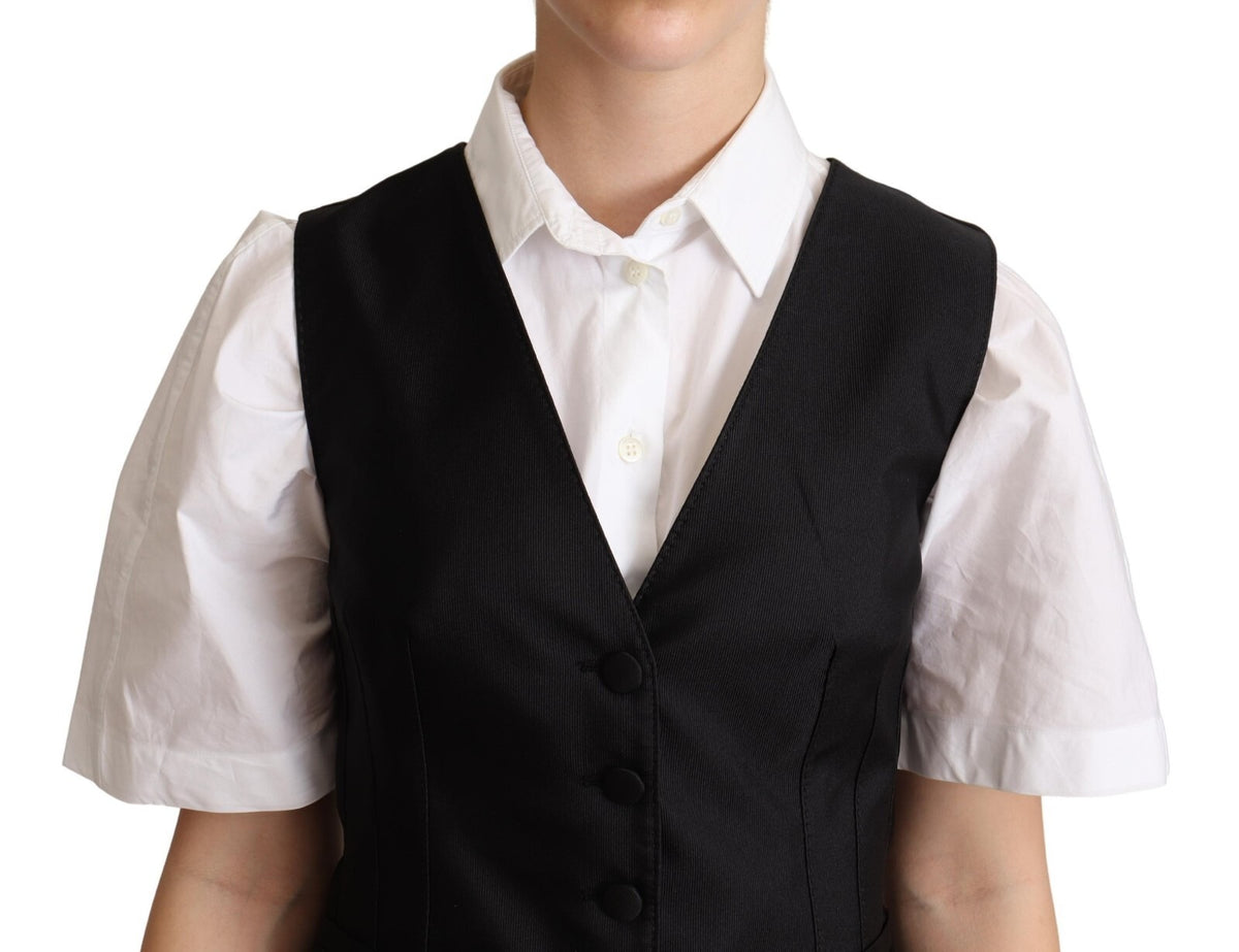 Elevate your wardrobe with the Dolce & Gabbana Solid Black Silk Sleeveless Waistcoat, a masterpiece of Italian craftsmanship that embodies timeless elegance and sophistication.