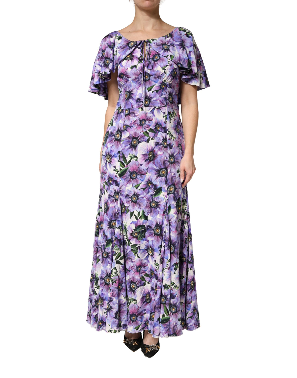 Indulge in the exquisite Dolce & Gabbana Purple Floral Silk Stretch Elegant Gown, a timeless masterpiece crafted for those who embody luxury and sophistication.