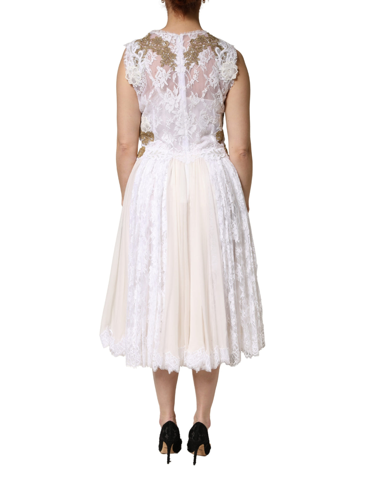 Indulge in the exquisite allure of the Dolce & Gabbana Ivory Lace Silk Embellished Sleeveless Dress, where intricate craftsmanship meets timeless elegance, perfect for unforgettable moments.