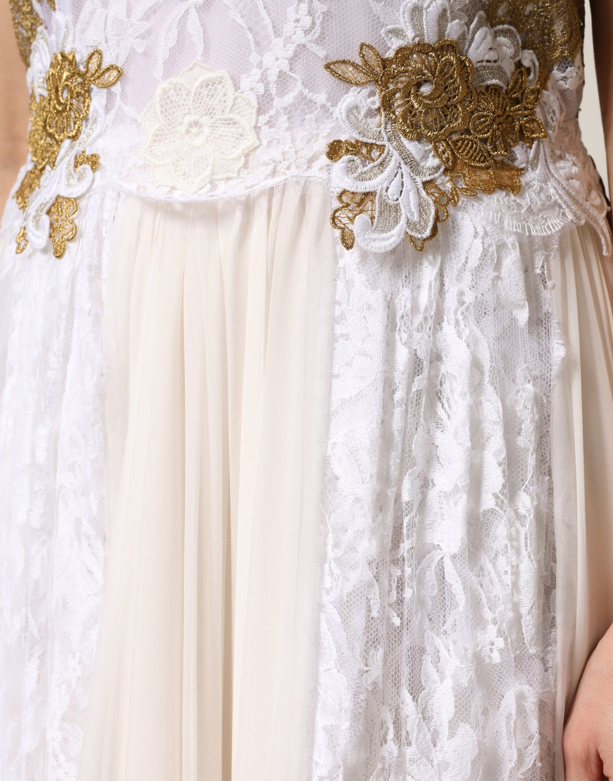 Indulge in the exquisite allure of Dolce & Gabbana's Ivory Lace Silk Embellished Sleeveless Dress, where intricate craftsmanship meets timeless elegance for unforgettable moments.