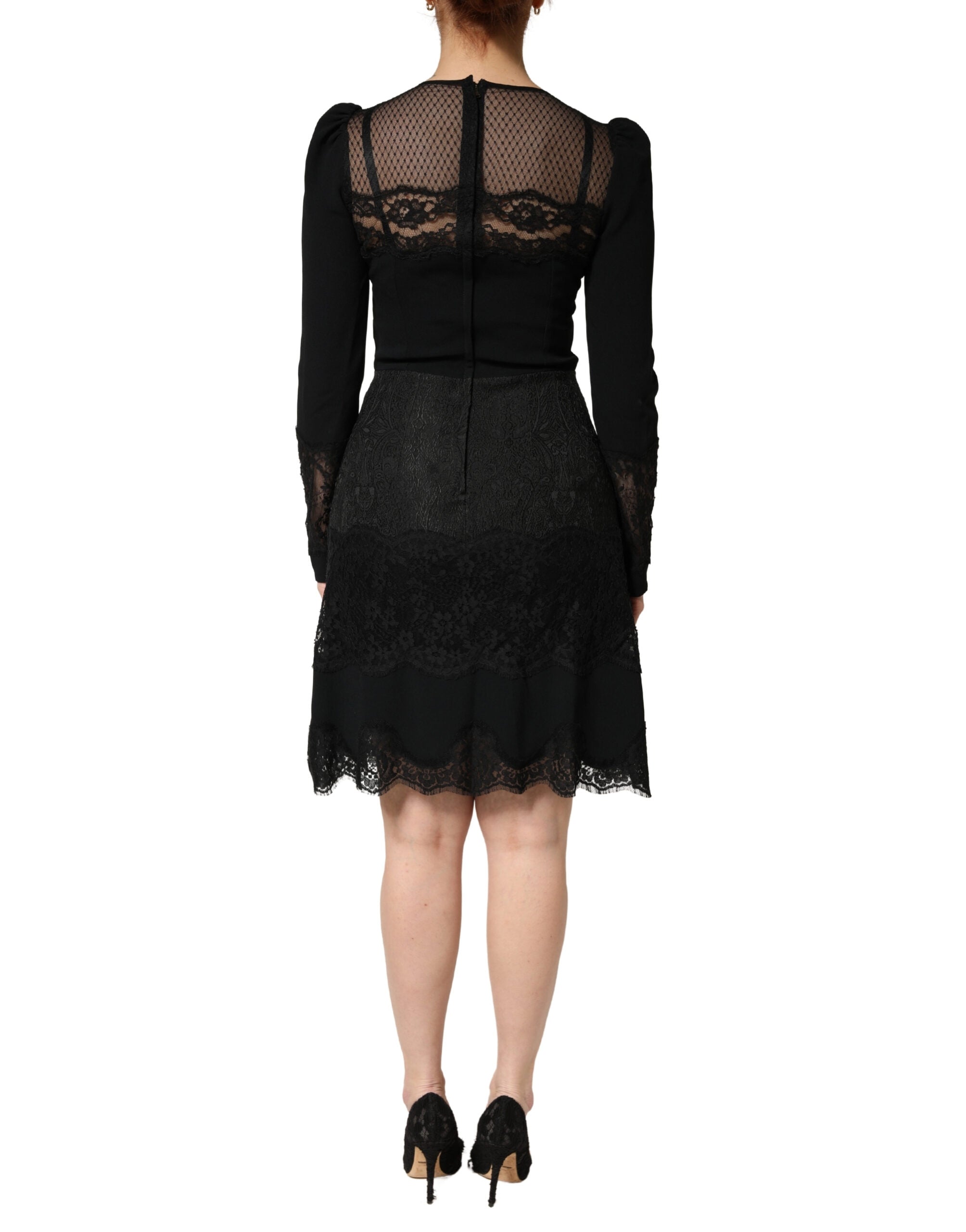 Experience the allure of Dolce & Gabbana's Black Lace Sheer Panel Midi Dress, where exquisite Italian craftsmanship meets luxurious femininity for unforgettable elegance.