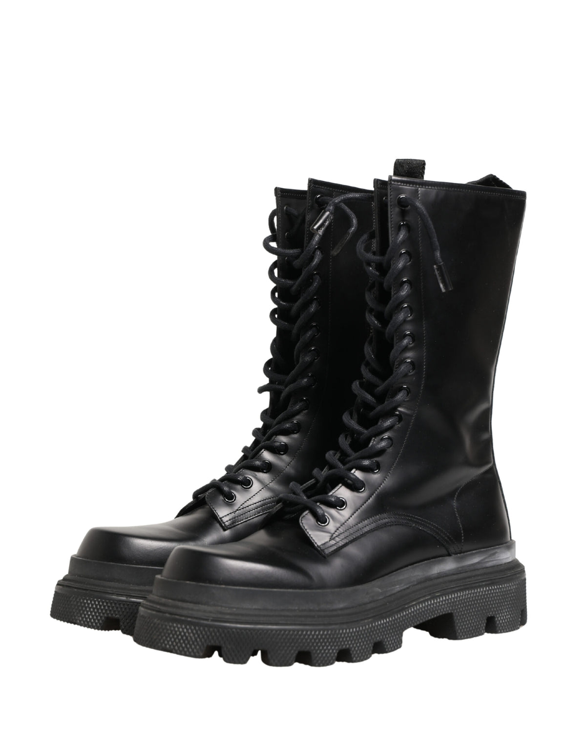 Step into the realm of sophistication with Dolce & Gabbana's Black Leather Trek Sole Combat Boots, crafted in Italy from premium spazzolato leather for timeless elegance.