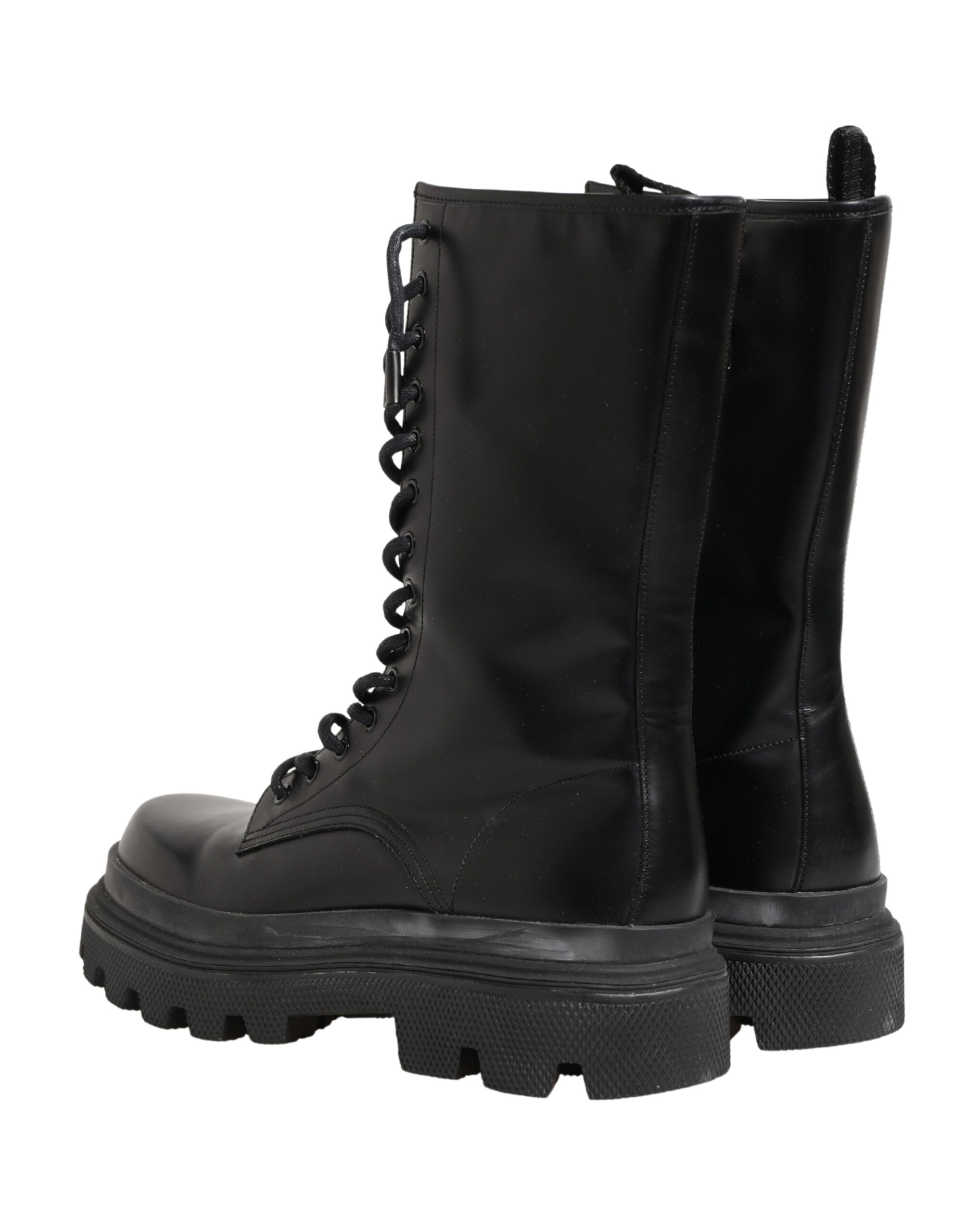 Indulge in the exquisite craftsmanship of Dolce & Gabbana's Black Leather Trek Sole Combat Boots, where luxury meets modernity, perfect for the discerning individual.