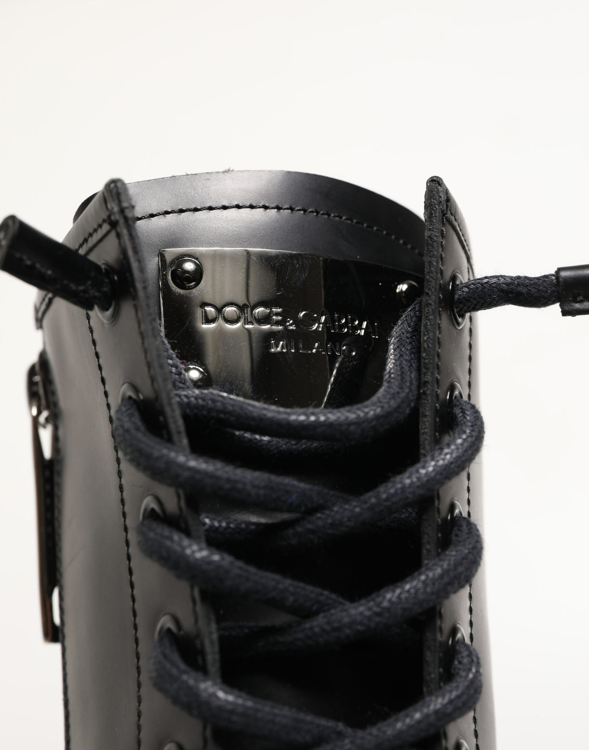 Indulge in the exquisite allure of Dolce & Gabbana's Black Leather Trek Sole Combat Boots, where Italian craftsmanship meets modern elegance for the discerning individual.