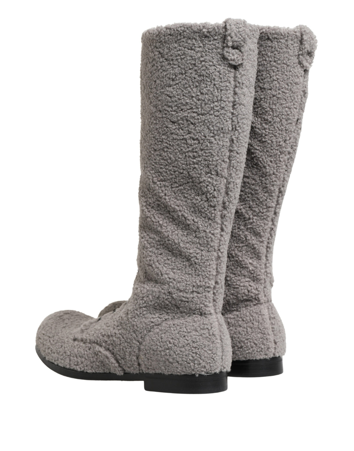 Discover the exquisite Dolce & Gabbana Gray Shearling Lace Up Knee High Boots, a luxurious blend of Italian craftsmanship and contemporary elegance, perfect for any sophisticated wardrobe.