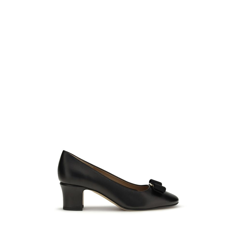 Experience the allure of Ferragamo Black Calf Leather Bos Taurus High Heel Pumps, where exquisite craftsmanship meets timeless elegance for the discerning individual.