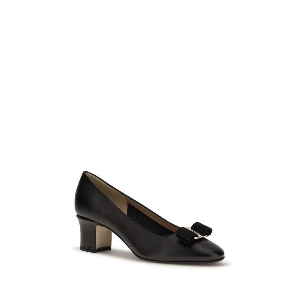 Experience the allure of Ferragamo Black Calf Leather Bos Taurus High Heel Pumps, where exquisite craftsmanship meets timeless elegance, redefining luxury for the discerning individual.