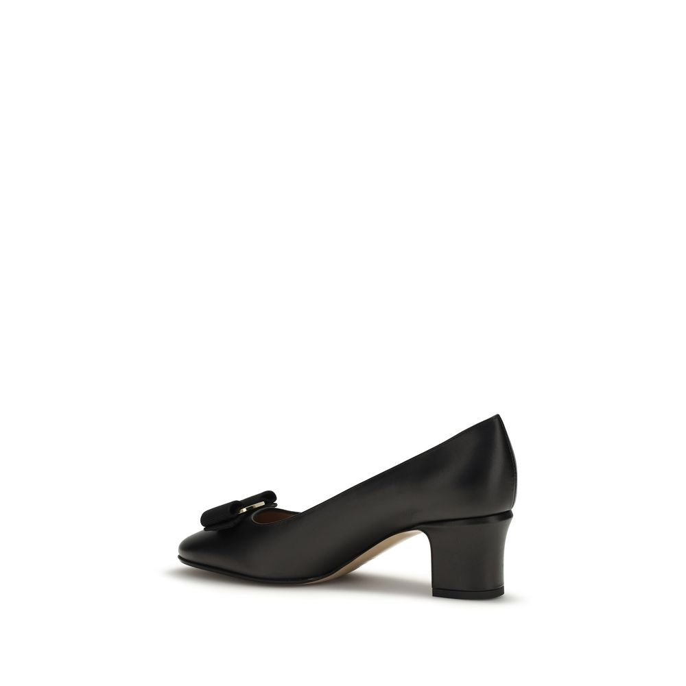 Step into the allure of Ferragamo's Black Calf Leather Bos Taurus High Heel Pumps, where exquisite craftsmanship meets timeless elegance for the discerning individual.