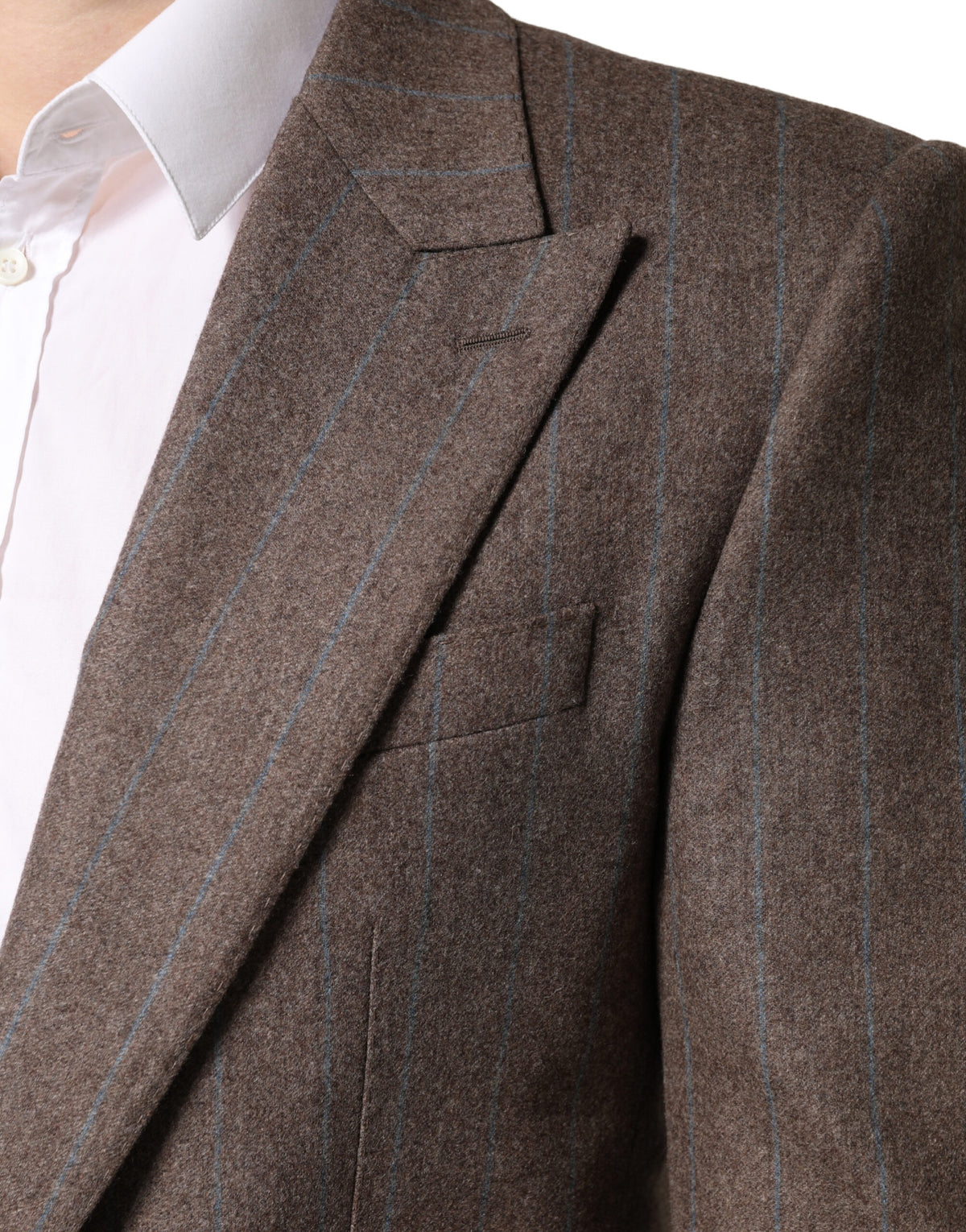 Experience the allure of the Dolce & Gabbana Brown Stripes Single Breasted Blazer, crafted from luxurious virgin wool and silk lining, embodying timeless elegance and Italian craftsmanship.
