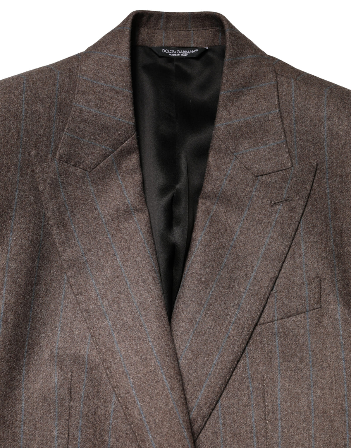 Indulge in the timeless elegance of the Dolce & Gabbana Brown Stripes Single Breasted Blazer, crafted from luxurious virgin wool, embodying Italian craftsmanship and sophistication for the discerning individual.