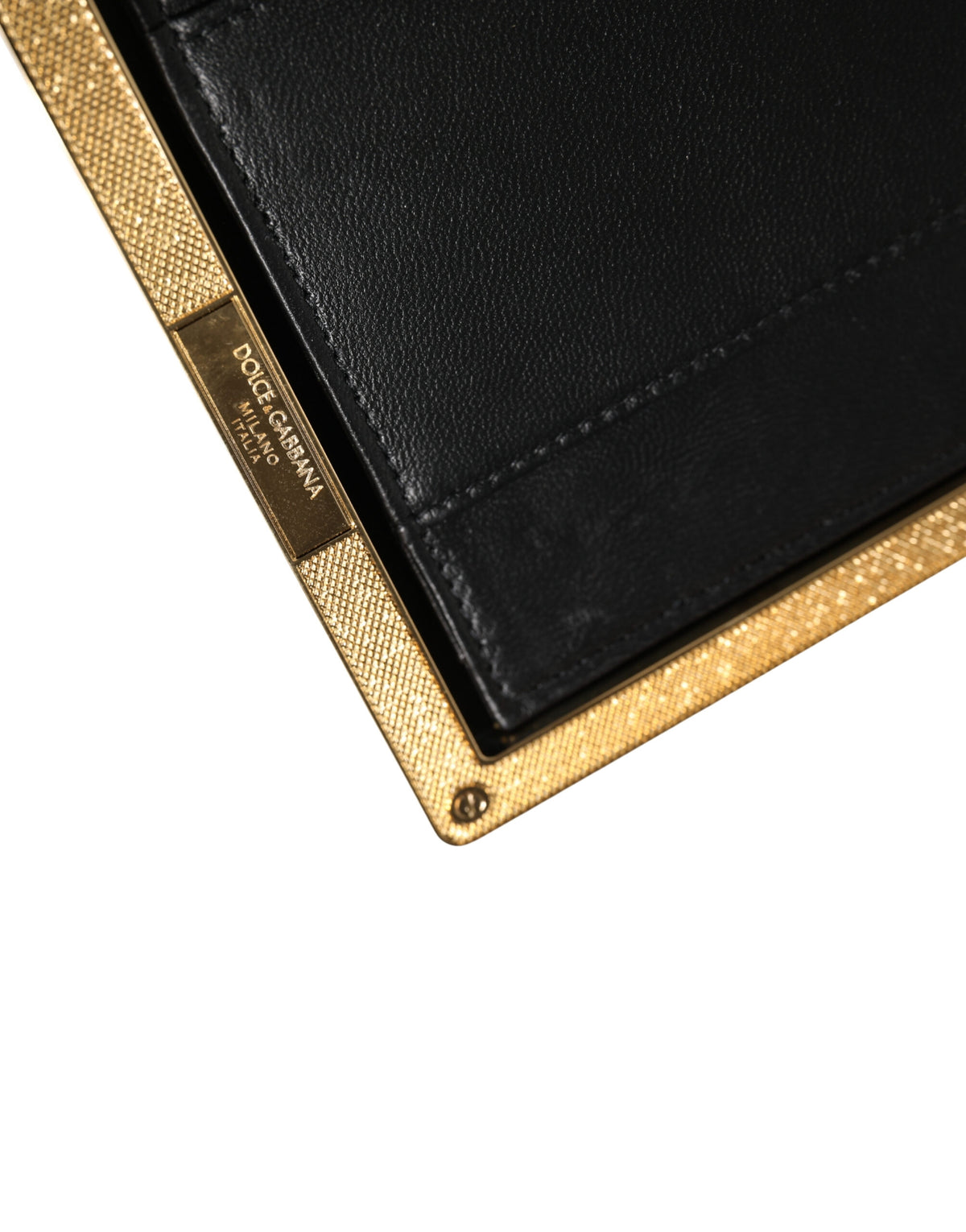 Indulge in the exquisite Dolce & Gabbana Beige Lambskin Leather Clutch, a masterpiece of Italian craftsmanship that elevates evening elegance with timeless allure.