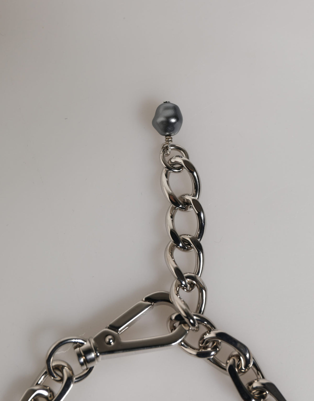 Experience the allure of the Dolce & Gabbana Silver Tone Chain Bracelet, where exquisite craftsmanship meets dark-hued pearls for a statement of modern luxury.