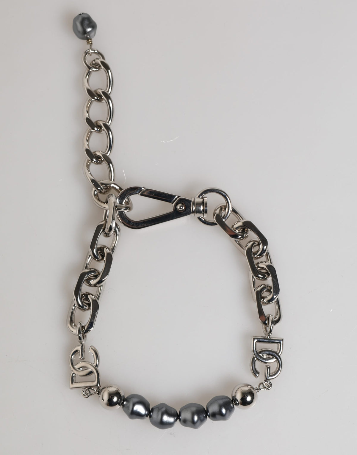 Elevate your elegance with the Dolce & Gabbana Silver Tone Chain Bracelet, a 2023 masterpiece of dark-hued pearls and Italian craftsmanship, perfect for any occasion.