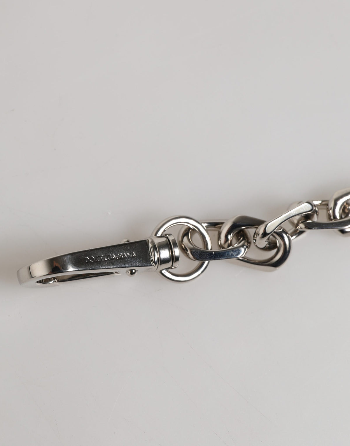 Elevate your elegance with the Dolce & Gabbana Silver Tone Chain Bracelet, a 2023 masterpiece of dark-hued pearls and exquisite Italian craftsmanship, perfect for any occasion.