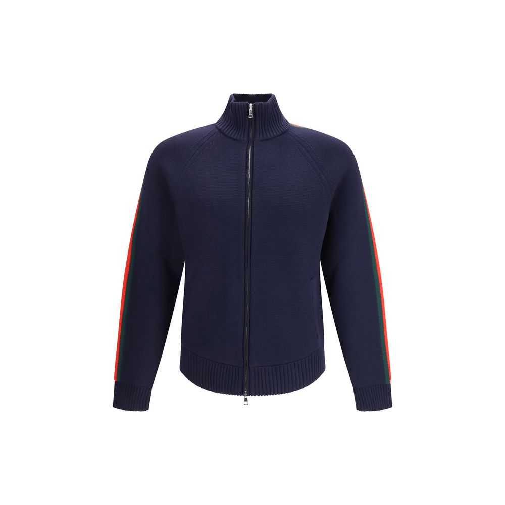 Indulge in the Gucci Blue Wool Trench Coat, a masterpiece of 100% wool with GG shearling interior, embodying timeless luxury and sophisticated elegance for the discerning individual.