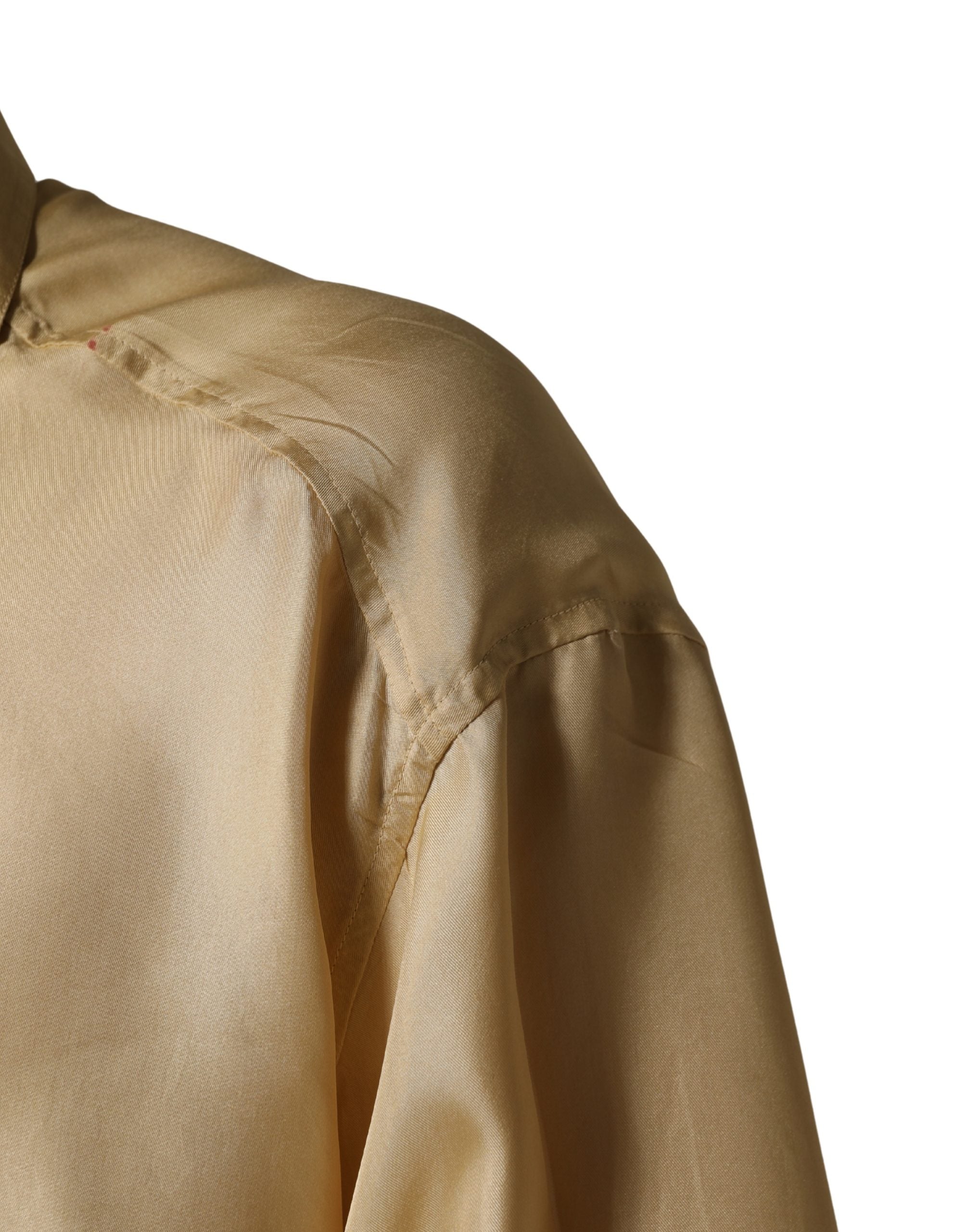 Indulge in the exquisite Dolce & Gabbana Yellow Silk Button Down Shirt, a luxurious blend of refined craftsmanship and bold elegance, perfect for any sophisticated wardrobe.