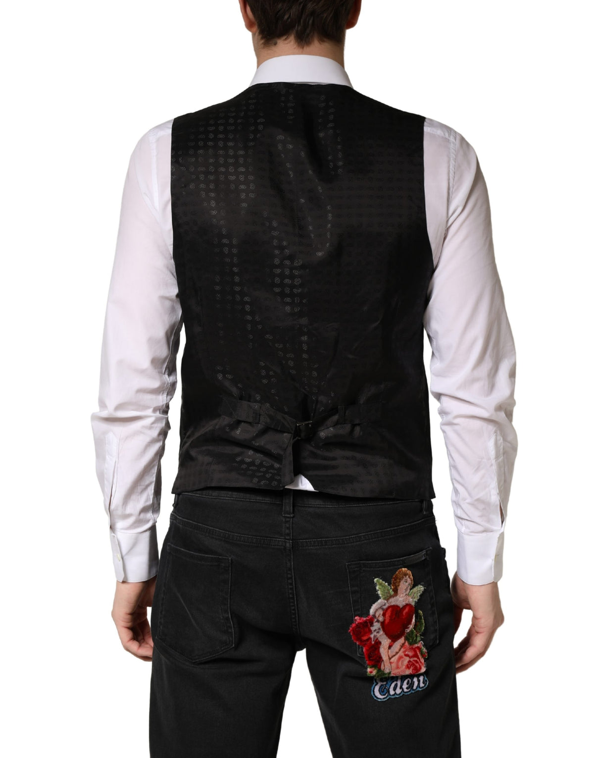 Discover the Dolce & Gabbana Black Wool Dress Waistcoat, a masterpiece of Italian craftsmanship, blending luxurious materials for timeless elegance in every occasion.