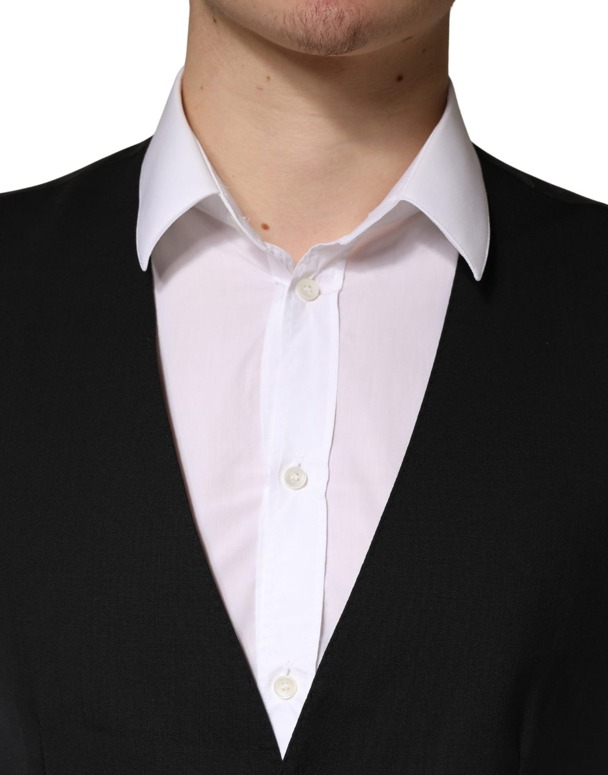 Elevate your wardrobe with the Dolce & Gabbana Black Wool Dress Waistcoat, a masterpiece of Italian craftsmanship designed for the discerning individual who appreciates timeless elegance.