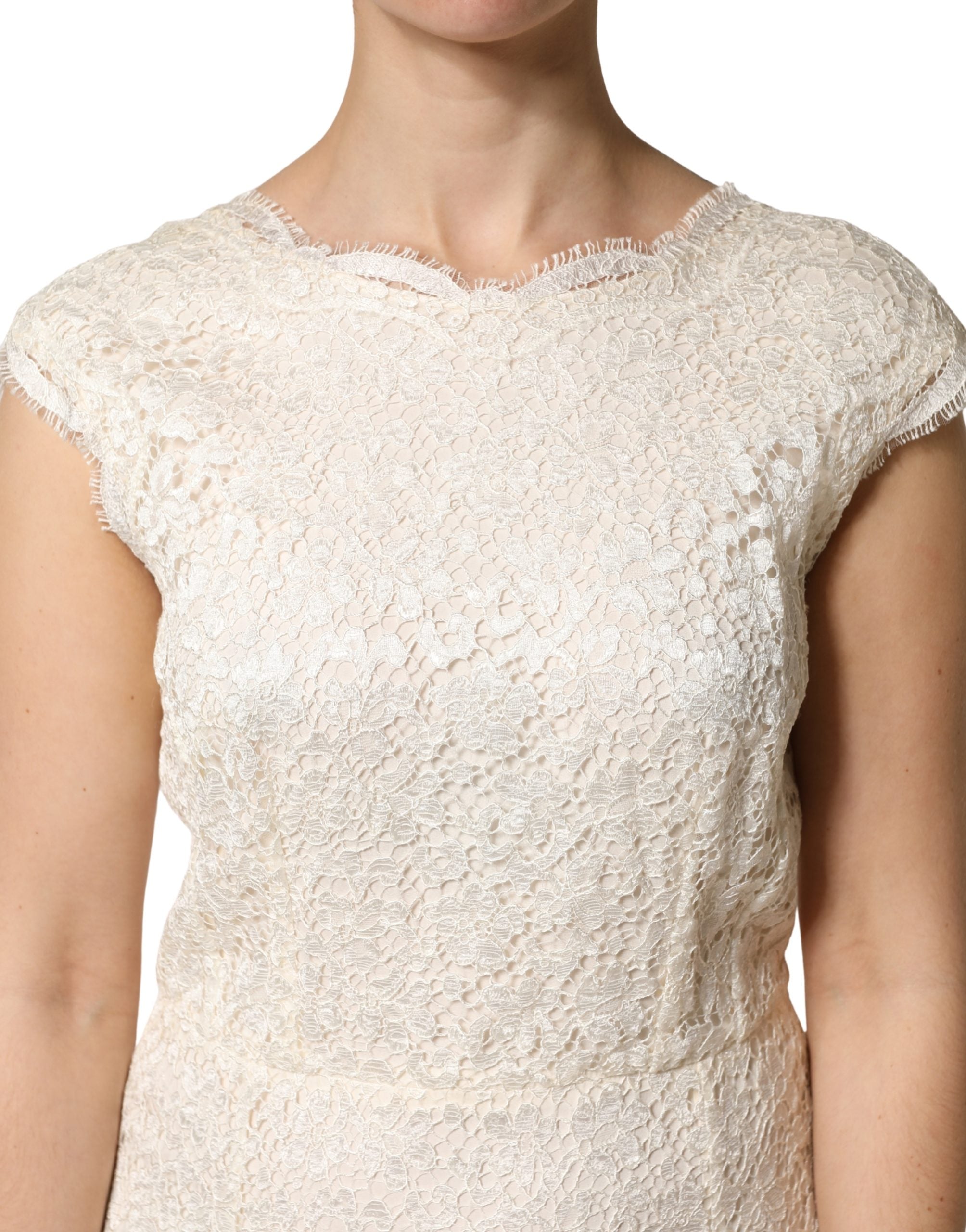 Experience the allure of Dolce & Gabbana's White Lace Viscose Sheath Long Gown, a masterpiece of Italian craftsmanship that redefines elegance for unforgettable moments.