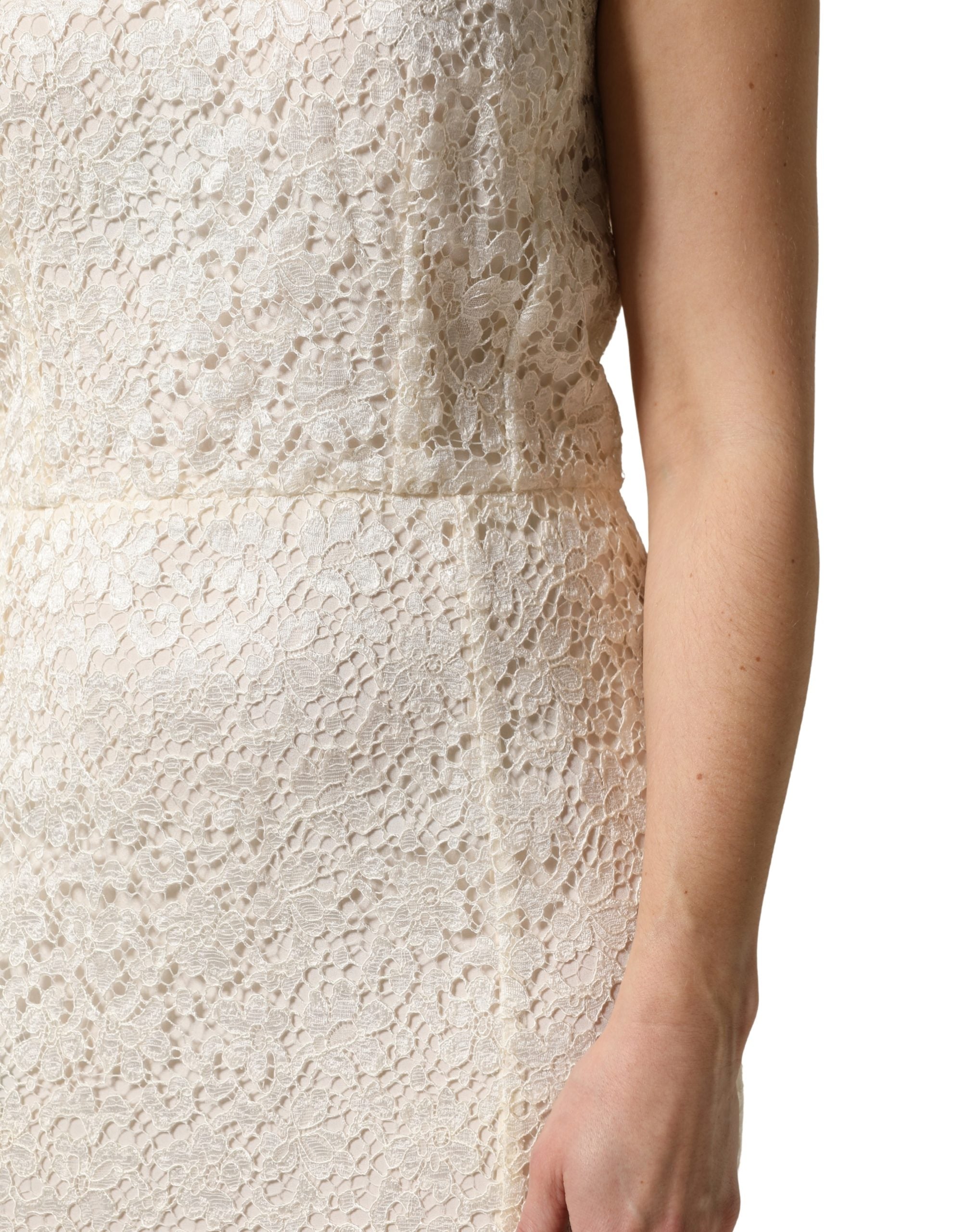 Experience the allure of Dolce & Gabbana's White Lace Viscose Sheath Long Gown, a masterpiece of Italian craftsmanship that redefines elegance for unforgettable evenings.