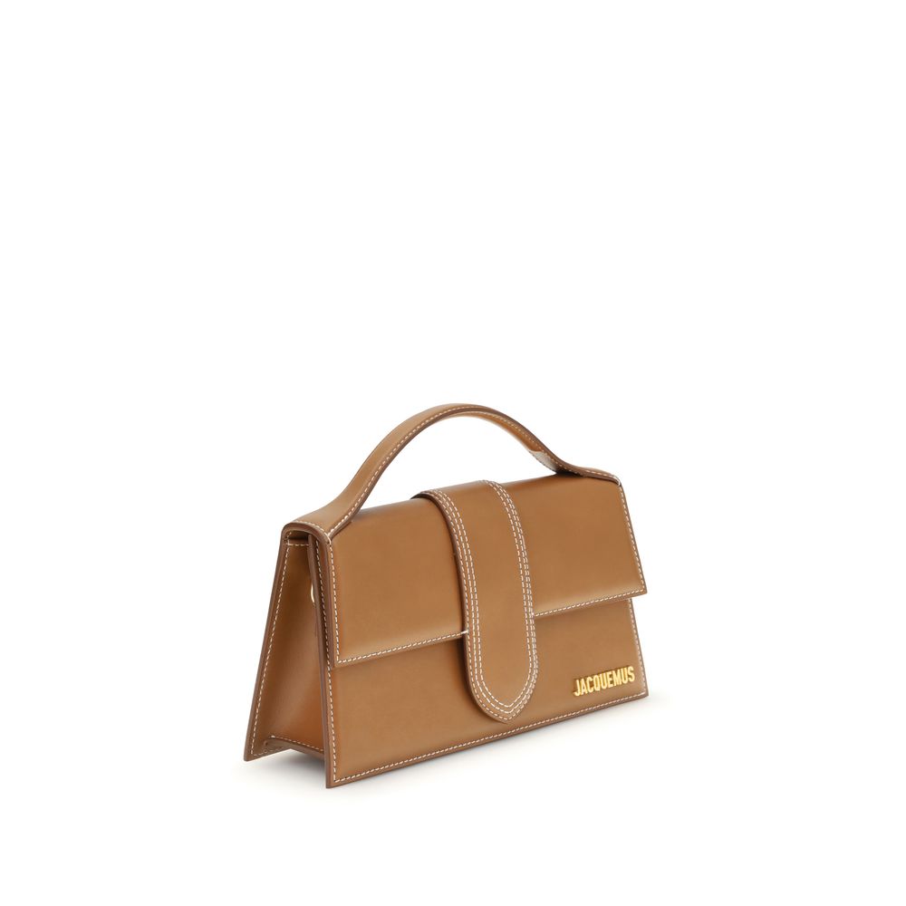 Discover the Jacquemus Brown Calf Leather Bos Taurus Handbag, a symbol of exquisite craftsmanship and timeless elegance, perfect for those who appreciate luxury.