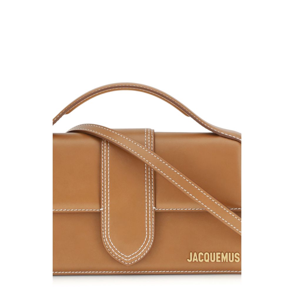 Indulge in the Jacquemus Brown Calf Leather Bos Taurus Handbag, a masterpiece of SS26 craftsmanship, blending luxurious elegance with versatile sophistication for discerning connoisseurs.