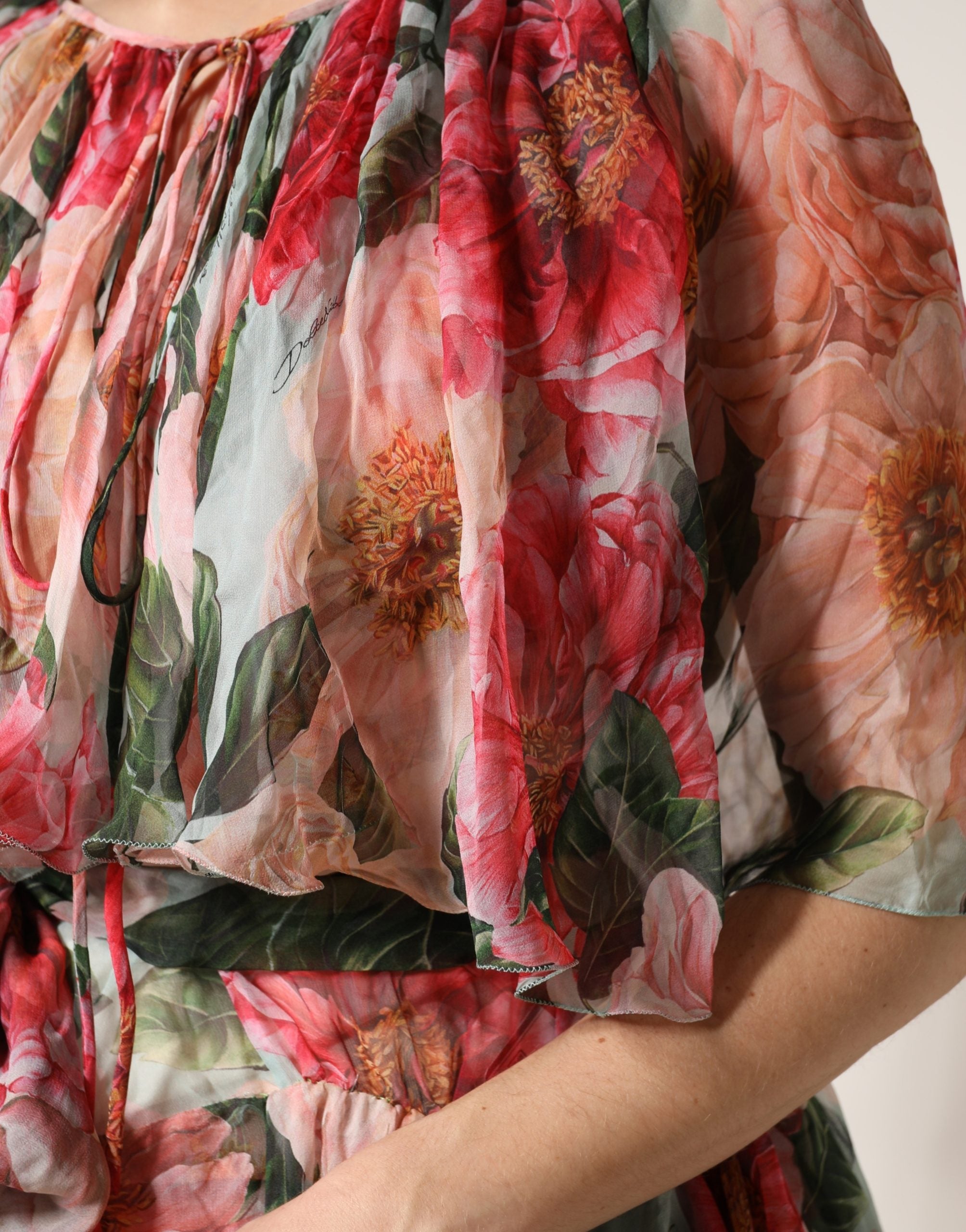 Discover the Dolce & Gabbana Multicolor Floral Silk Layered Maxi Dress, a masterpiece of Italian craftsmanship that embodies luxury and timeless elegance for unforgettable moments.