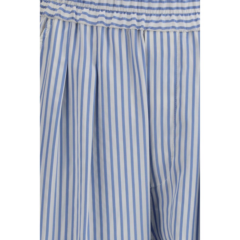 Indulge in the Tom Ford Multicolor Silk Casual Pants, crafted from exquisite striped silk for a refined elegance that elevates every moment with effortless sophistication.