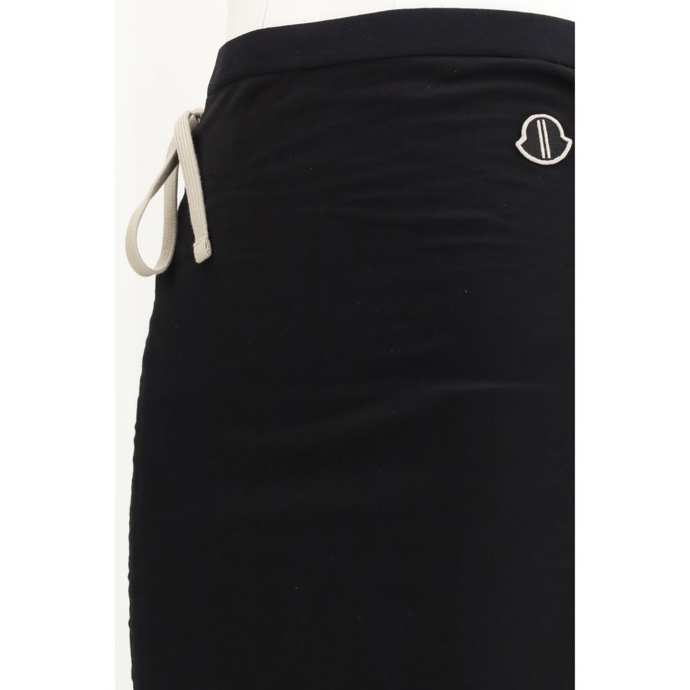 Elevate your wardrobe with the Moncler x Rick Owens Black Cotton Long Skirt, a masterpiece of luxury and streetwear chic, designed for those who command attention.