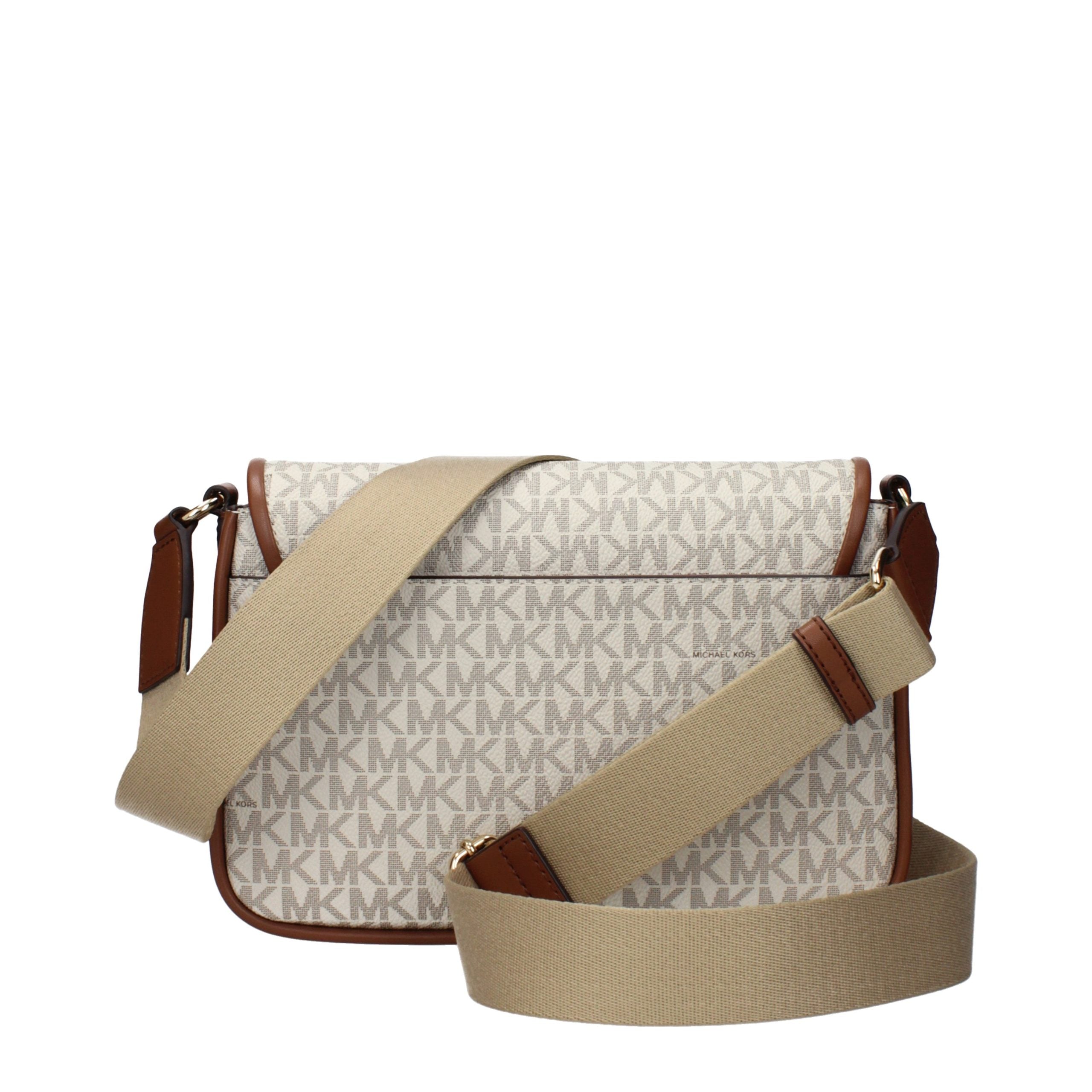 Indulge in the exquisite elegance of the Michael Kors Beige Fabric Crossbody Bag, a timeless accessory that embodies luxury and sophistication for every occasion.